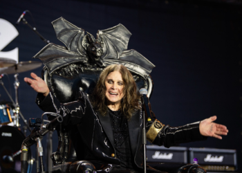 Ozzy Osbourne on stage in classic pose – tribute image