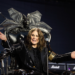 Ozzy Osbourne on stage in classic pose – tribute image